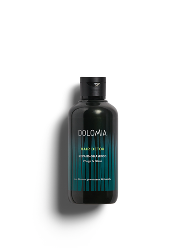 Dolomia Hair Detox Repair-Shampoo – Repair-Shampoo mit Detox-Wirkung, enthält zu 100 % aus Bäumen gewonnene Aktivstoffe: nährt, schützt und regeneriert geschädigtes Haar. Erhältlich im Shop der Helios Apotheke Klosters.