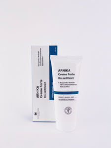 Arnika Creme Forte – mit speziellem Extrakt aus den Blüten der Bergarnika. Erhältlich im Shop der Helios Apotheke Klosters.